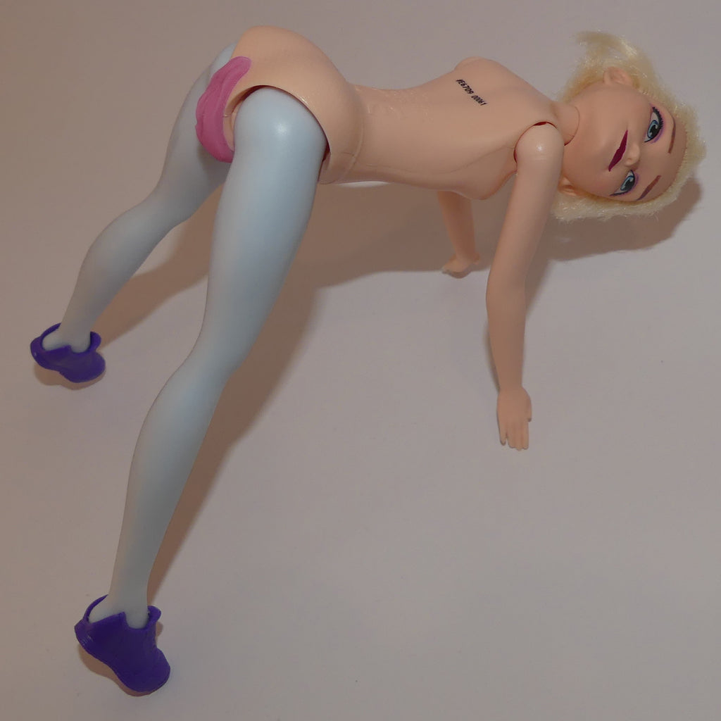 A blonde female action figure posed on all fours against a plain light background.