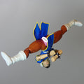 Street Fighter 6 Chun-Li action figure BarbieVagina posed upside down against a solid gray background.